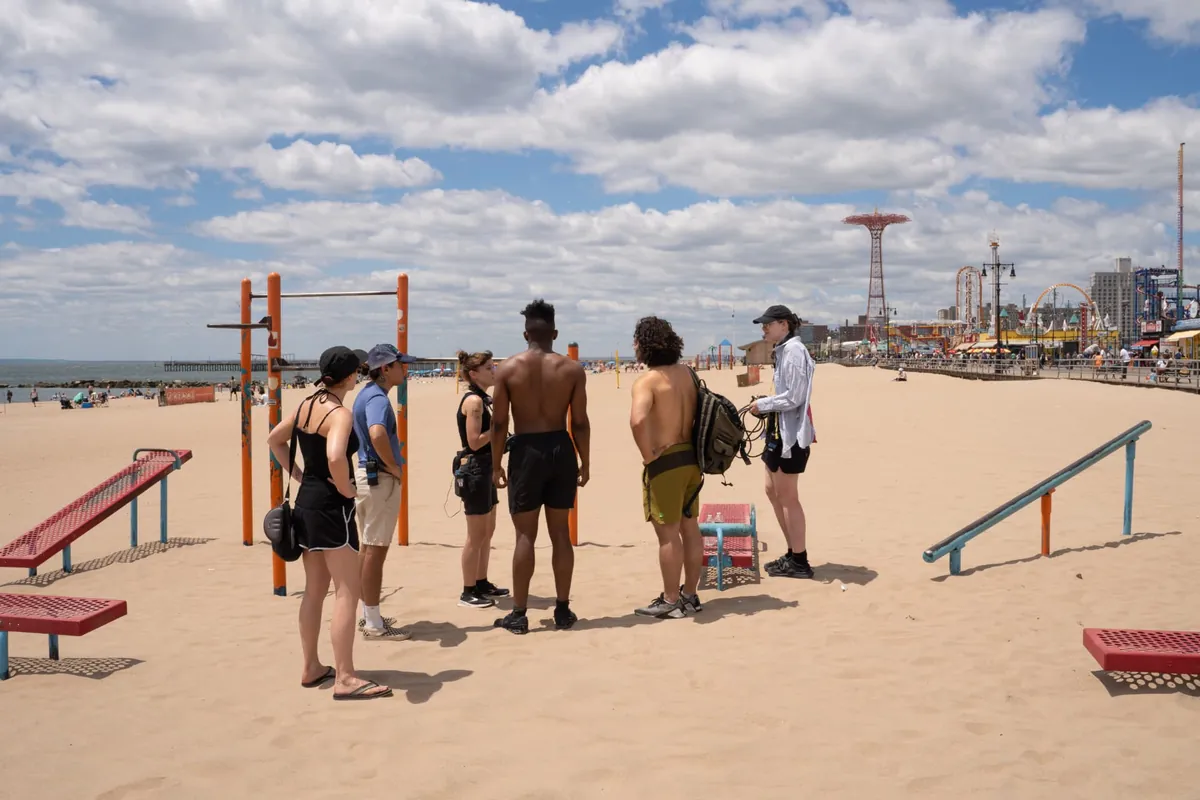 Behind the scenes — setting up a shot with Coney Island amusement rides in the distance