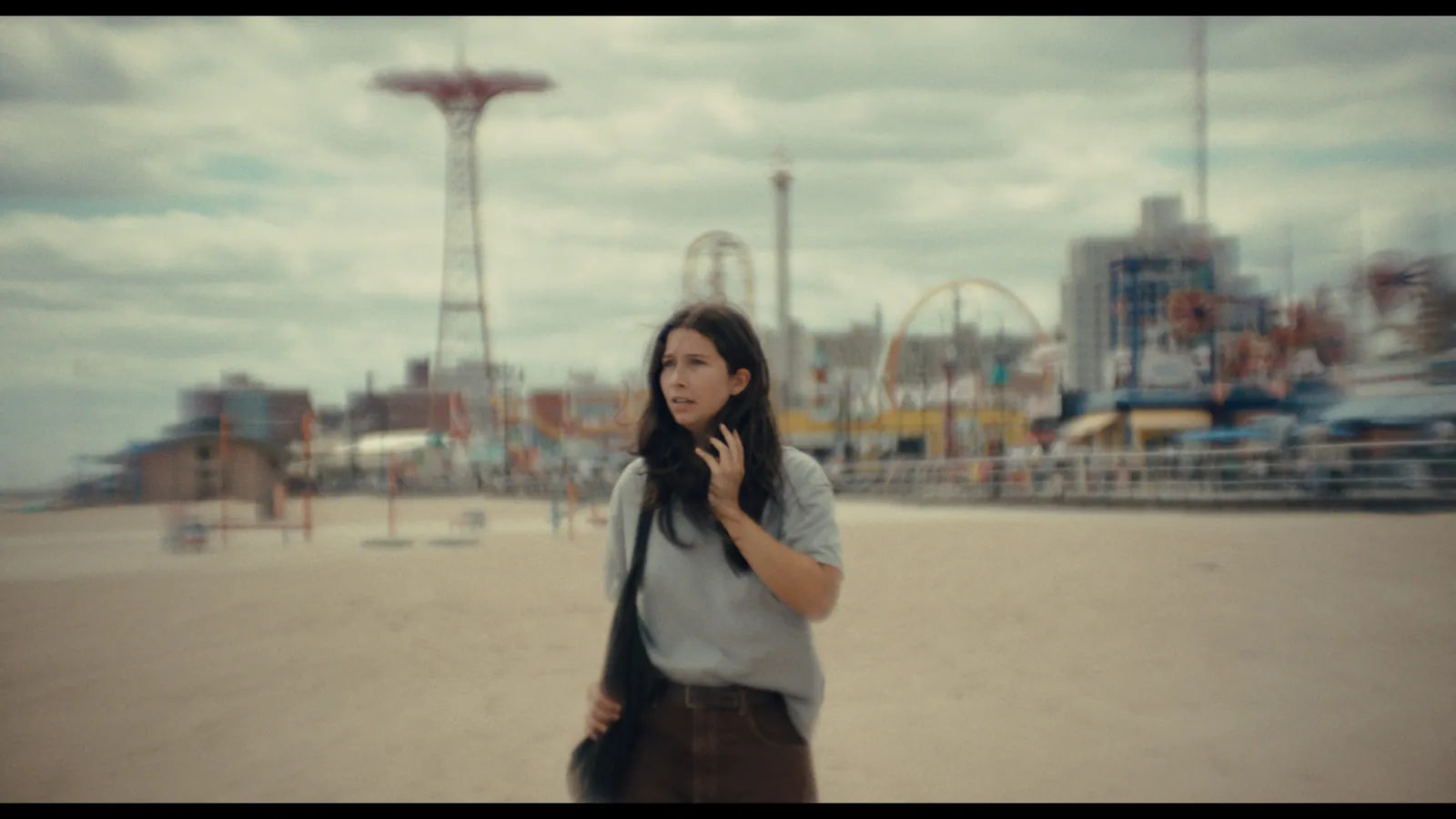 Perfect Love still — a woman on the beach at Coney Island