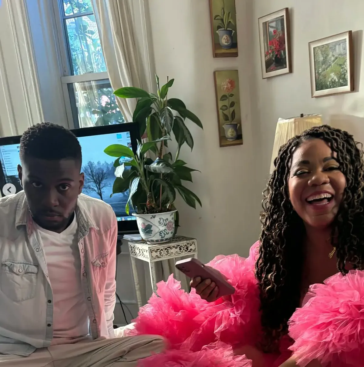 Behind the scenes on Divine Intervention — two cast members relaxing between takes